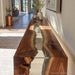 Waterfall epoxy console table placed in modern hallway interior
