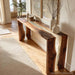 Side angle showing flowing waterfall resin edges on black walnut console table