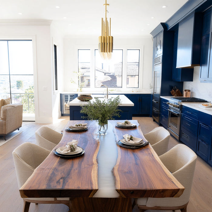 Modern dining area with a wooden table and chairs in a well-lit room.