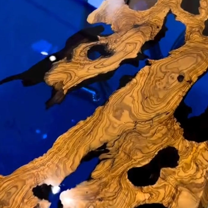 Blue epoxy and burl wood furniture centerpiece with artistic design