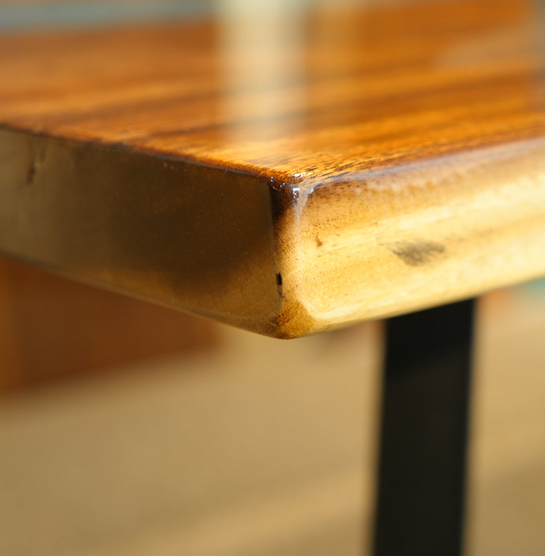 Live edge epoxy resin table with a vibrant blue river design and a durable clear resin tabletop finish