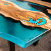 Blue epoxy live edge table crafted from natural walnut