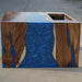 Blue epoxy walnut statement table for a contemporary interior