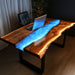 Modern live edge epoxy desk with glowing blue LED resin river for home office setup