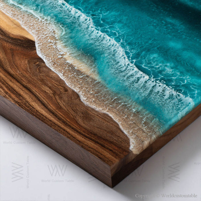 Epoxy river table made of walnut wood, filled with blue ocean resin and decorated with foamy wave accents.