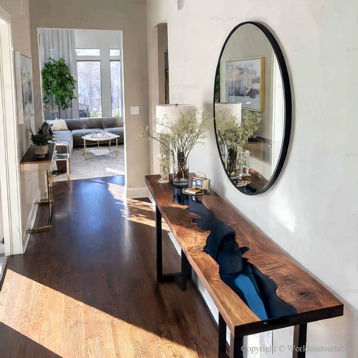 Close up of blue resin river and walnut grain on console table