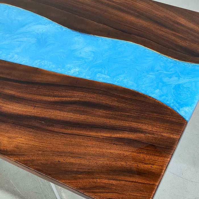 Edge detail showing the flowing blue resin river and walnut wood texture