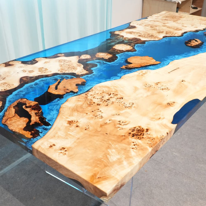Blue and white ocean wave dining table with handcrafted resin details