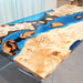 Blue and white ocean wave dining table with handcrafted resin details