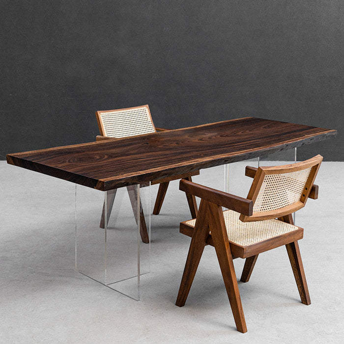 Luxury table crafted from a century-old rain tree slab, offering warmth and timeless elegance.