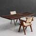 Luxury table crafted from a century-old rain tree slab, offering warmth and timeless elegance.