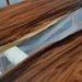 Clear resin walnut dining table showcasing rich natural grain and premium craftsmanship