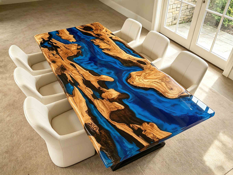 Coastal modern dining table with natural olive wood grain and vivid blue epoxy river, durable waterproof tabletop for dining room