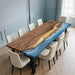 Handcrafted walnut coastal resin river table with translucent ocean epoxy