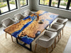 Coastal style dining table featuring golden camphor wood and flowing resin wave patterns.