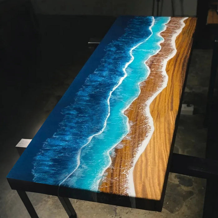 Coastal style live edge epoxy river table with ocean art