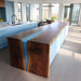 Contemporary epoxy dining table displayed as centerpiece