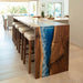 Contemporary ocean wave epoxy dining table displayed as centerpiece