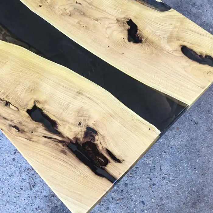 Modern poplar and black resin table in a co-working lounge setting