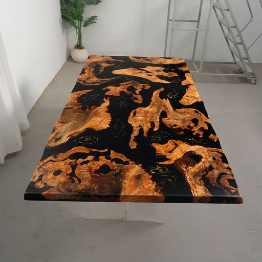 Dining table with a unique black and brown pattern in a minimalistic room.