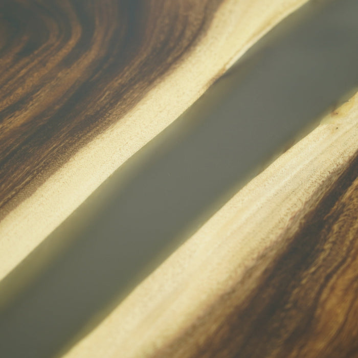 Handmade epoxy river table with premium walnut wood.
