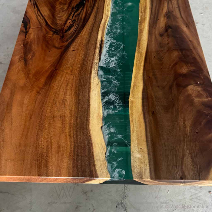 Wooden table with a central river of water running through it, branded 'AVW'.
