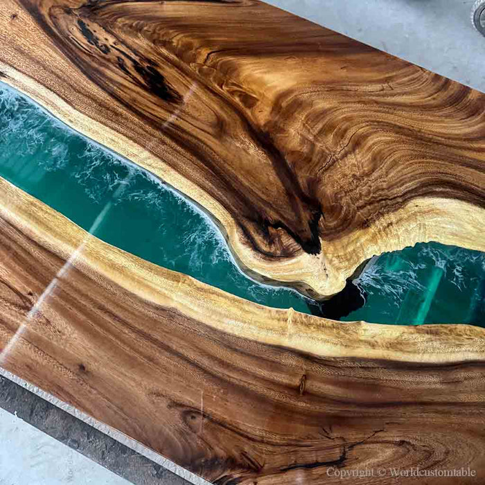 Wooden table with a central green river-like design
