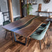 Custom blue epoxy river table made from solid black walnut wood with live edge, showcasing unique grain and vibrant blue resin river design for luxury dining or conference room.