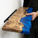 Custom handcrafted blue epoxy and natural wood live edge floating shelf for living room and home decor