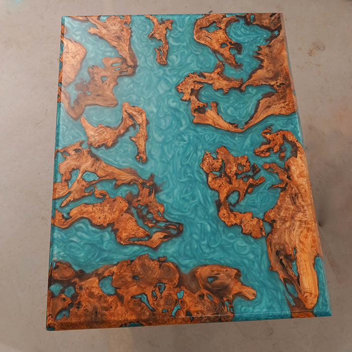 Tabletop with a unique design featuring copper-colored patterns on a blue background