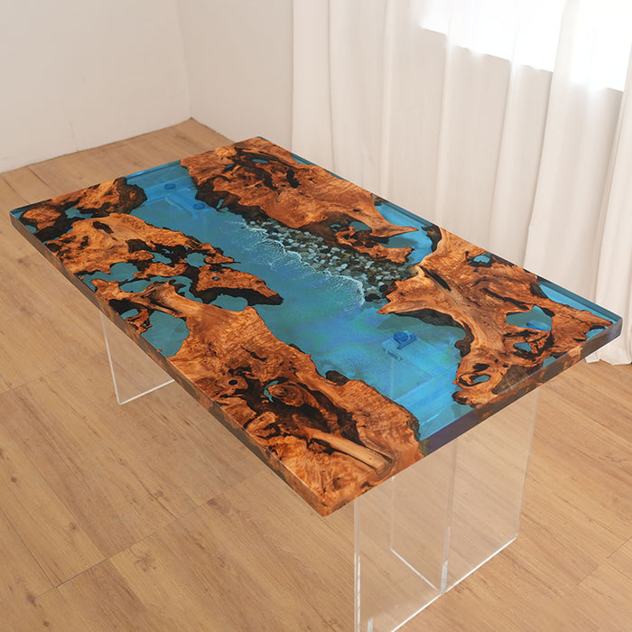 Table with a unique design featuring blue resin and brown wood on a wooden floor.