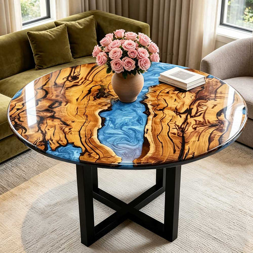 Custom round olive wood coffee table with swirling blue epoxy resin river, modern living room decor