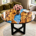 Custom round olive wood coffee table with swirling blue epoxy resin river, modern living room decor