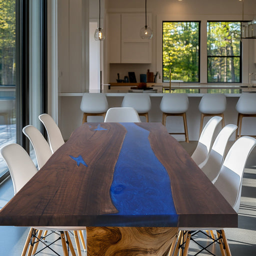 Handmade epoxy river table with live edge wood and blue resin.