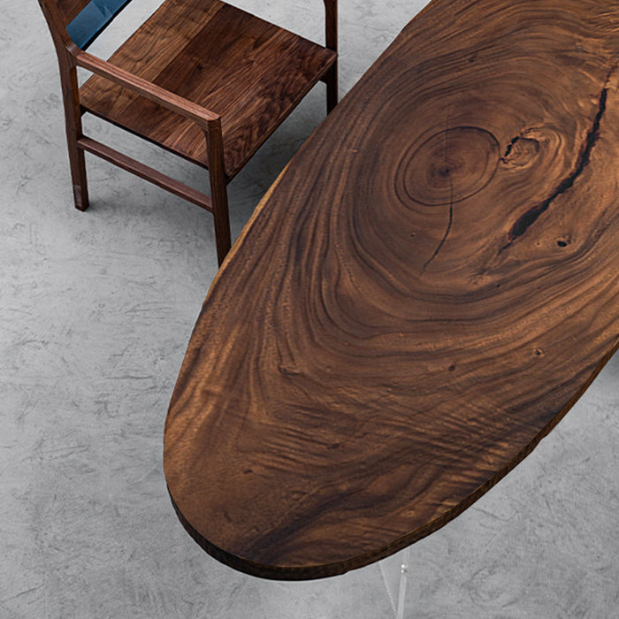 Custom elliptical table built from walnut wood natural slabs, perfect for modern interiors.