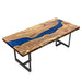 Custom elm wood dining table featuring deep blue epoxy resin river and natural wood grain texture for elegant dining spaces.