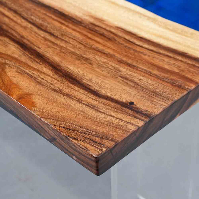 Close-up of a wooden surface with a blue background