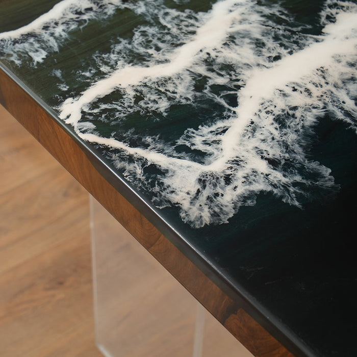The epoxy resin wood table with a high-gloss finish and a modern acrylic base