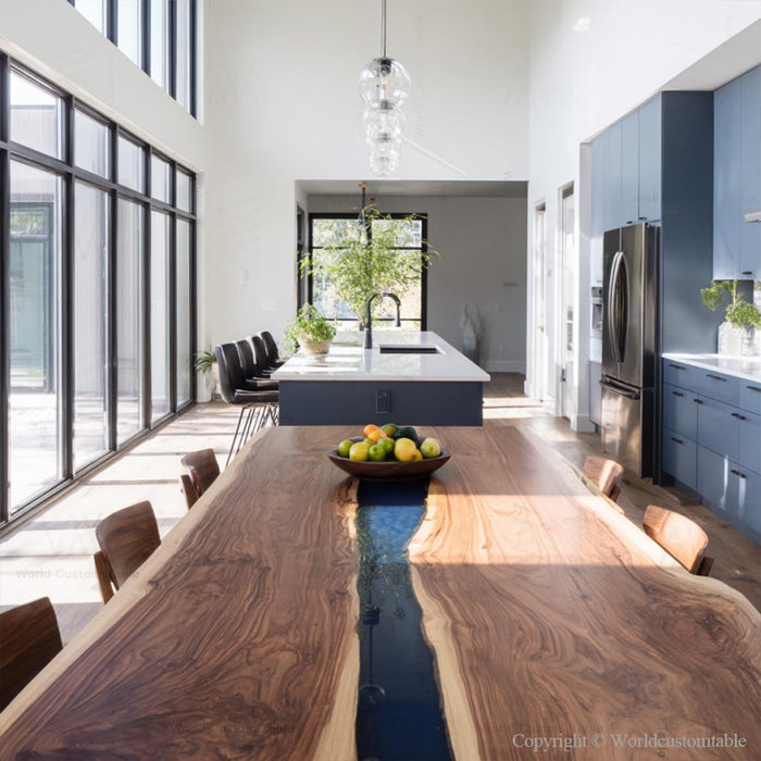 Custom epoxy dining table with ocean inspired blue resin and solid walnut construction