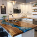 Ocean blue epoxy river table highlighting natural walnut wood texture and grain pattern