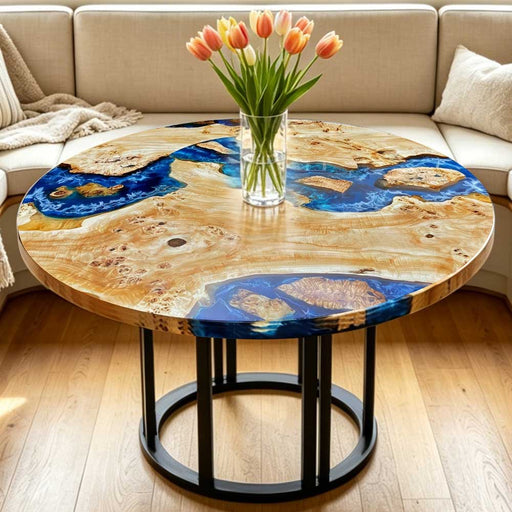 Handcrafted live edge wood and blue resin dining table for luxury interior design.