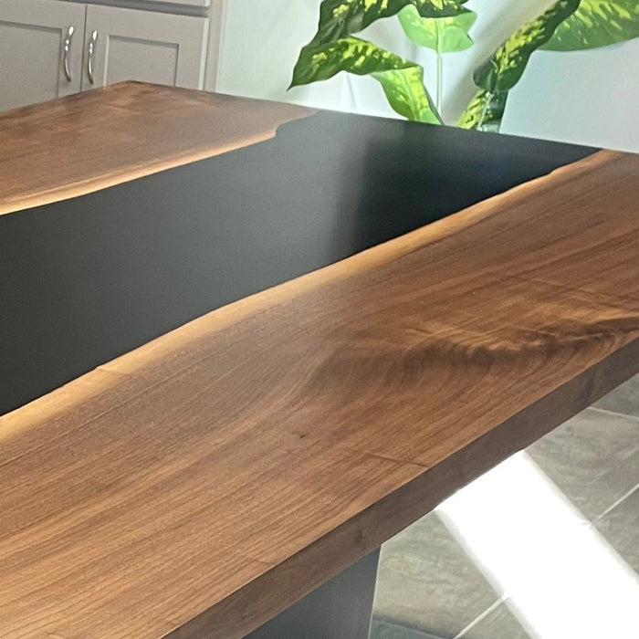 Custom epoxy river table enhancing minimalist interior kitchen decor.