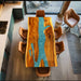 Unique handcrafted walnut epoxy dining table with vibrant blue-green tones