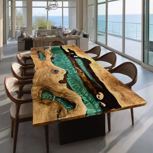 Dining table with unique design in a modern room with large windows overlooking the ocean.