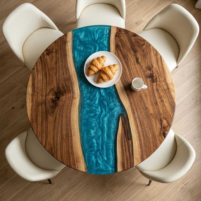 Handcrafted circular river table made from dark walnut and semi-transparent blue epoxy resin.