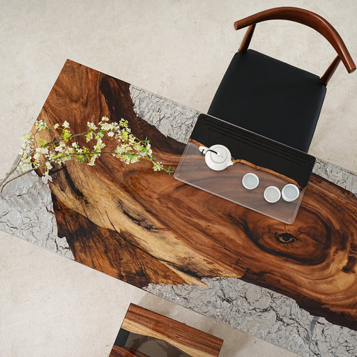 Custom ice crystal epoxy dining table with live-edge wood and scratch-resistant resin surface.