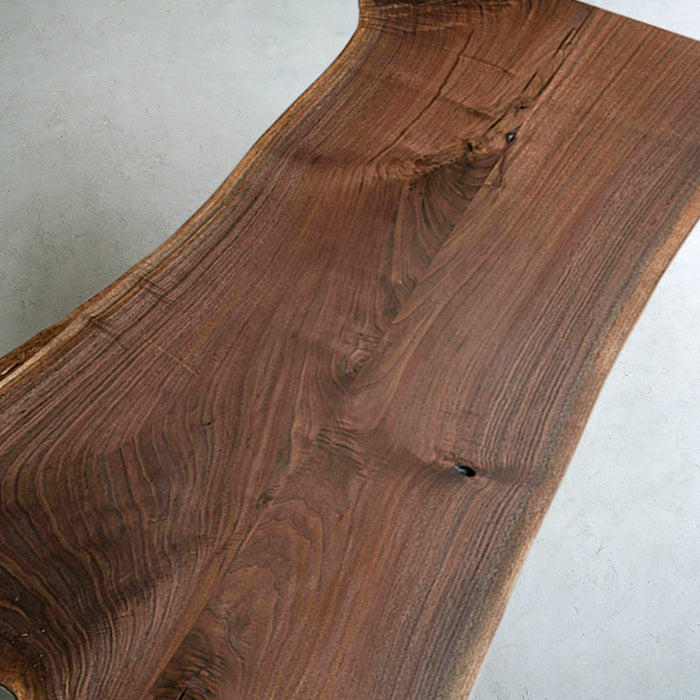 Custom irregular shaped black walnut table highlighting natural wood features and craftsmanship