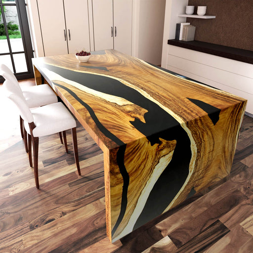 Wooden dining table with black resin inlay in a modern kitchen setting