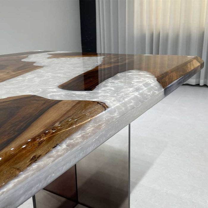 Custom live edge black walnut table with white swirl epoxy resin in Los Angeles.