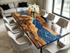Custom live edge walnut resin table with deep blue swirl effect